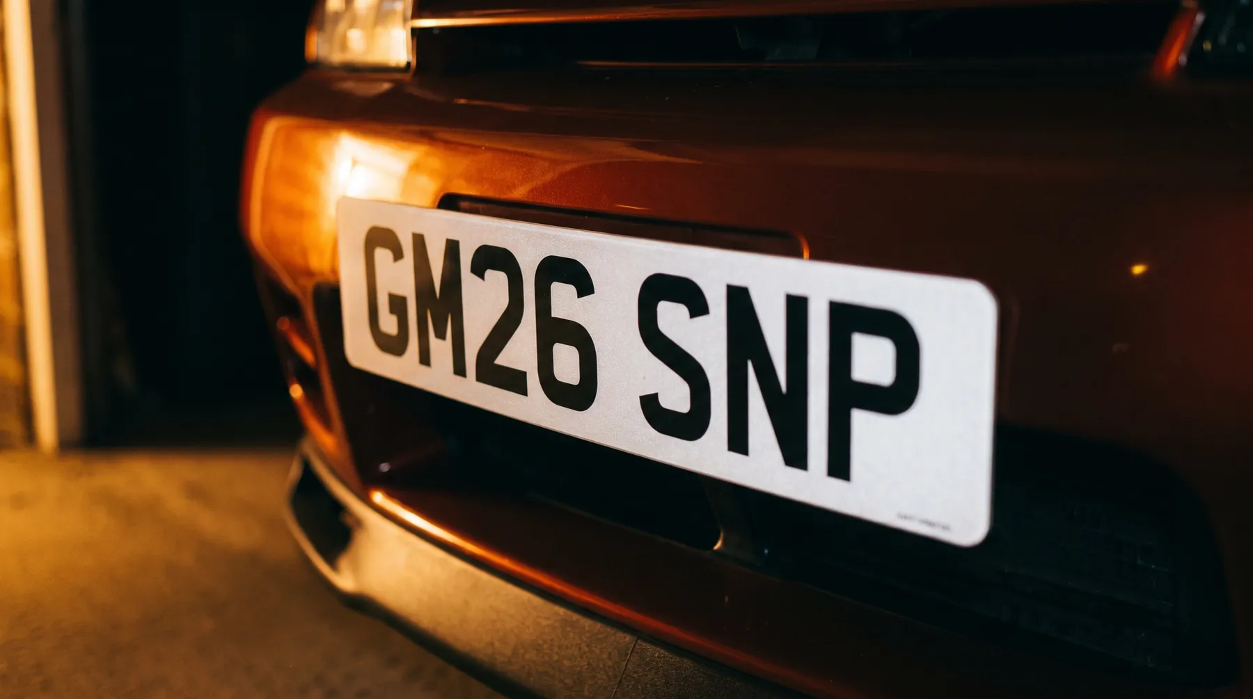 Registration documents and plain number plate characters arranged for a supplier check